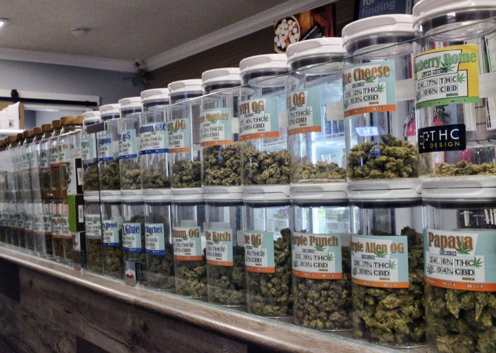 FILE - This Friday, Nov. 3, 2017 photo shows jars of medical marijuana on display on the counter of Western Caregivers Medical marijuana dispensary in Los Angeles.