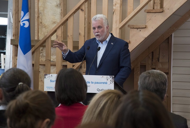 Quebec Premier Philippe Couillard speaks at a news conference, Sunday, December 10, 2017 at a physical rehab centre in Quebec City. Couillard announced a government plan to fight on poverty. 