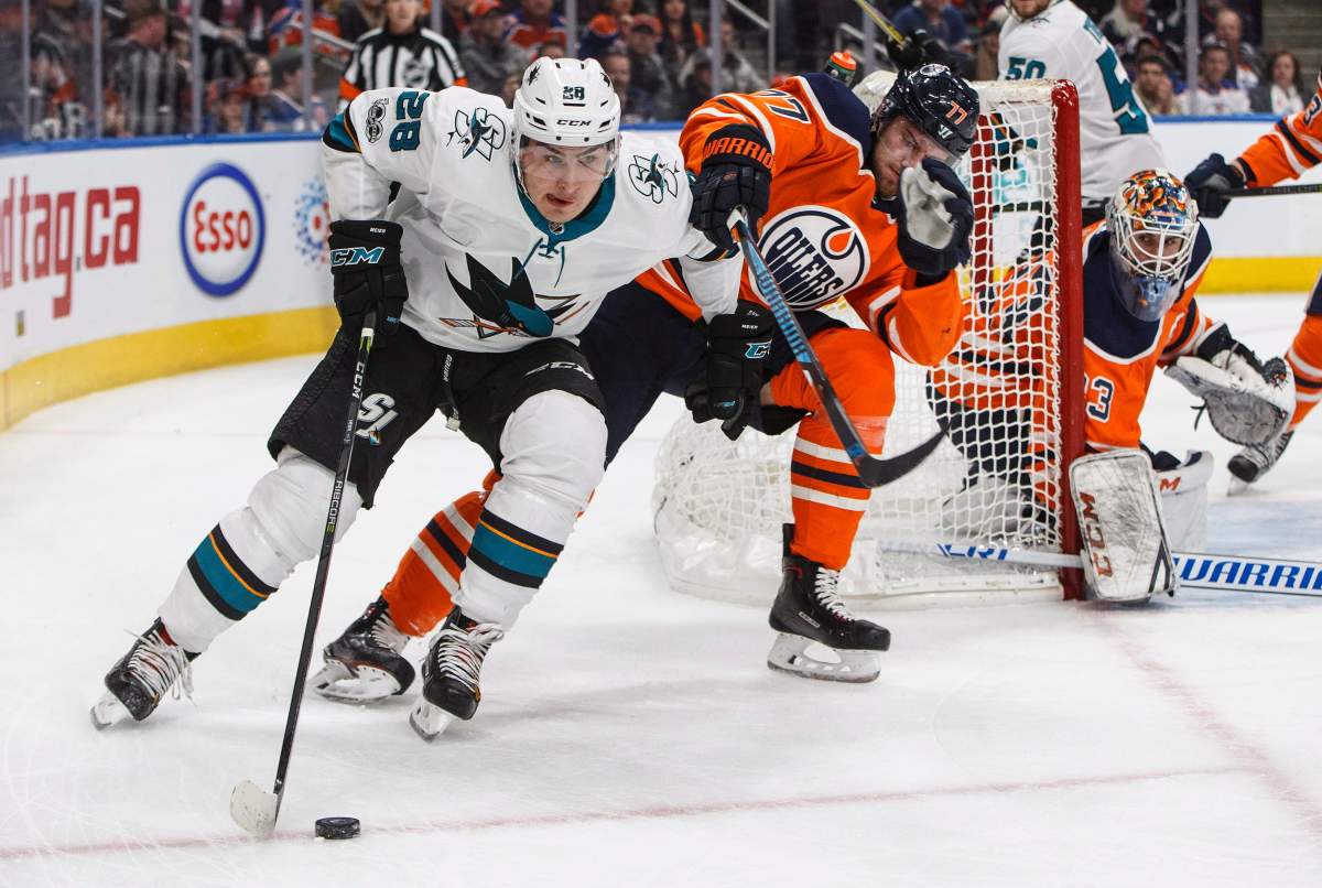 San Jose Sharks' Timo Meier (28) is chased by Edmonton Oilers' Oscar Klefbom (77) during first period NHL action in Edmonton, Alta., on Monday December 18, 2017. 