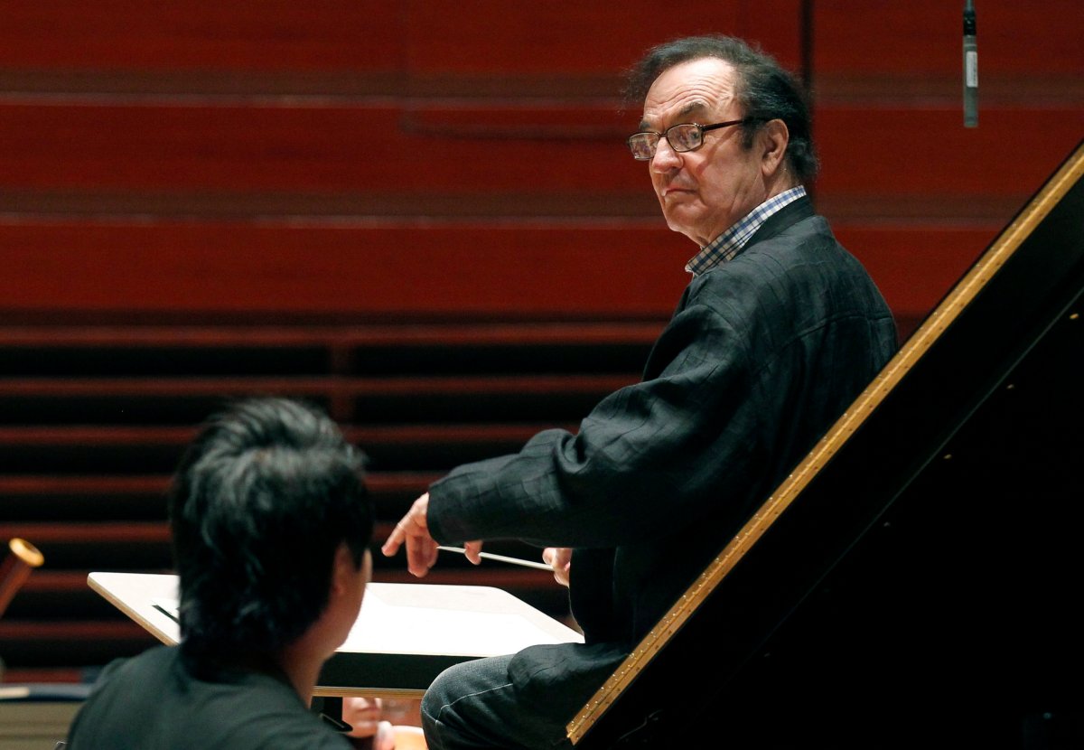In this Oct. 19, 2011 file photo, world-renowned conductor Charles Dutoit, right, performs with the Philadelphia Orchestra during a rehearsal in Philadelphia.