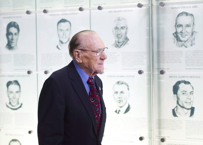 Johnny Bower walks to his seat as The Hockey Hall of Fame officially unveiled the “Esso Great Wall” as home to the Stanley Cup, all major NHL trophies and recognition structures for individuals elected into Honoured Membership in Toronto on March 9, 2012.