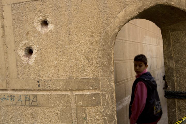 Bullets holes are seen on the police booth outside Mar Mina church, in Helwan, Cairo, Egypt, Dec. 29, 2017.