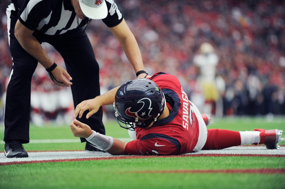 FILE - In this Sunday, Dec. 10, 2017, file photo, Houston Texans quarterback Tom Savage (3) is checked by a referee after he was hit during the first half of an NFL football game against the San Francisco 49ers, in Houston. 