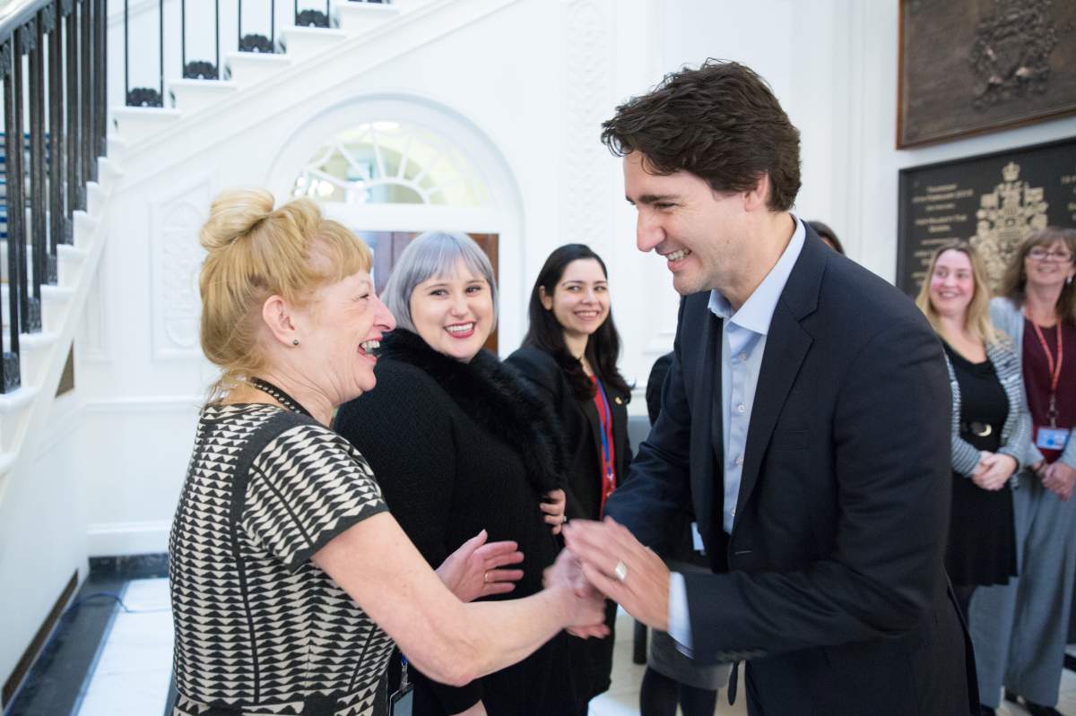 Prime Minister Trudeau meets with Canadian High Commission staff at Canada House in London. Nov. 26, 2015. Deborah Aitken, seen here shaking Trudeau’s hand, has been a consular officer for 25 years.