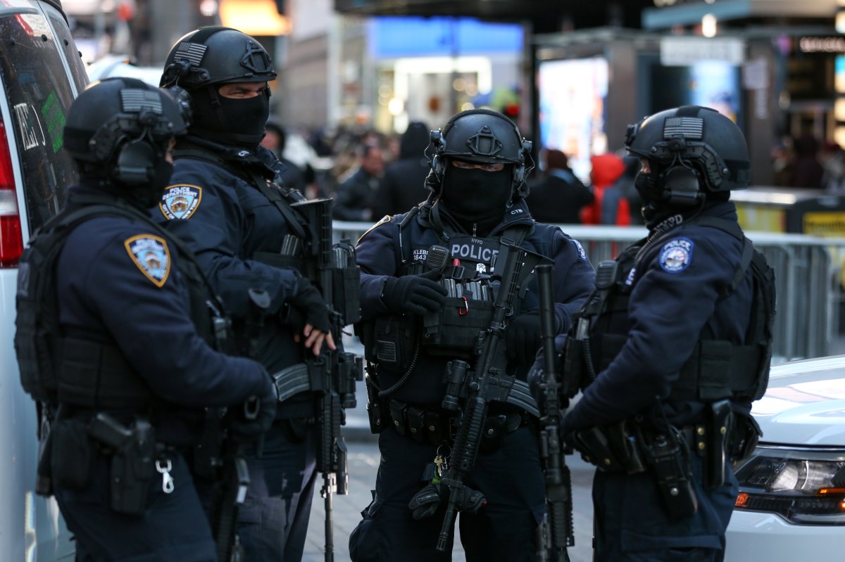 New York Police Department Counterterrorism Bureau members stand in Times Square to provide security ahead of New Year's Eve celebrations in Manhattan, New York, U.S. December 28, .
