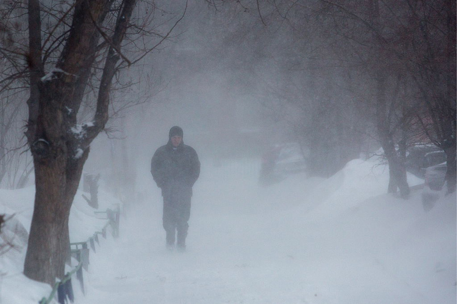 A man walks in a blizzard in Omsk, Russia in this file image. 