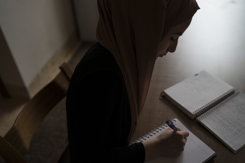 Ferah says writing helped her endure during the rule of the Islamic State group over her home city of Mosul, giving her an outlet to explore her fears and hopes.