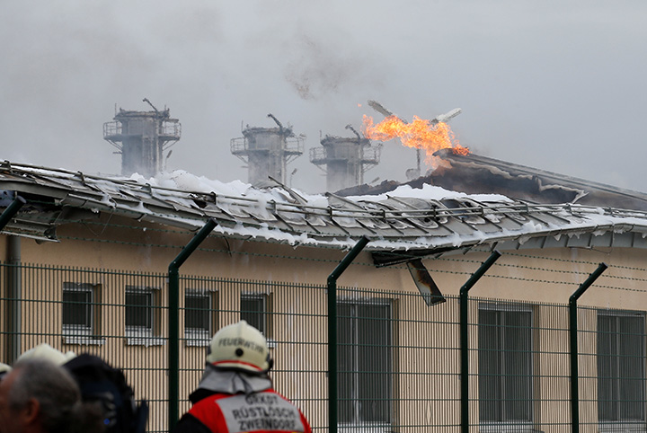 Firefighters are seen at the largest natural gas import and distribution station after a gas explosion in Baumgarten, Austria December 12, 2017.