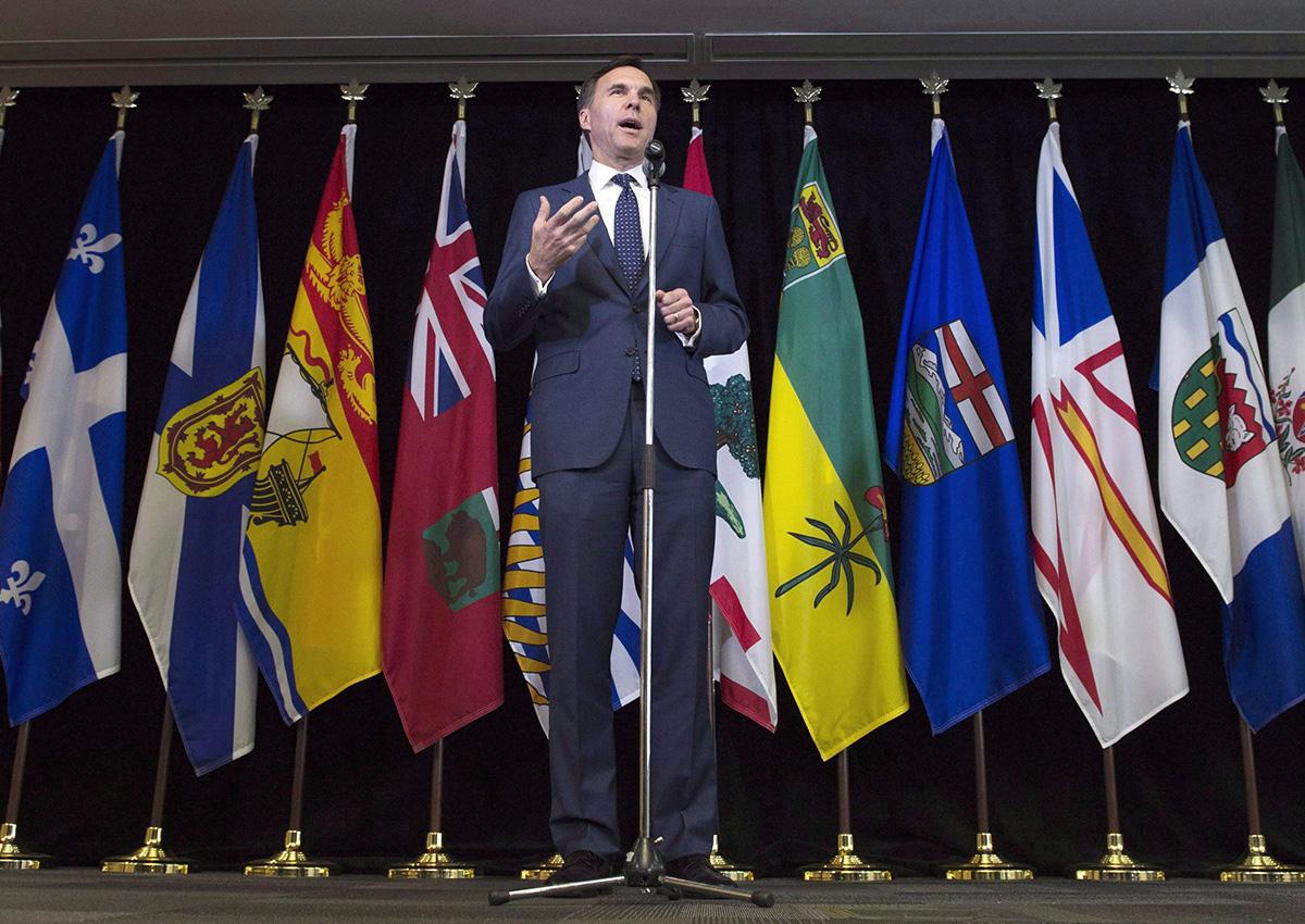 Finance Minister Bill Morneau speaks with the media following meetings with his provincial counterparts in Ottawa on June 19, 2017. 