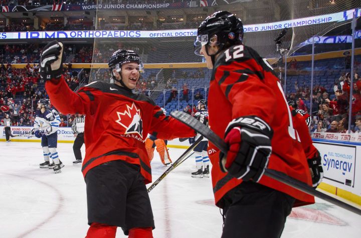 Canada's Boris Katchouk celebrates his goal with teammate Tyler Steenbergen, left, during the first period of IIHF World Junior Championship preliminary round hockey action against Finland, in Buffalo, N.Y., on Tuesday, December 26, 2017.
