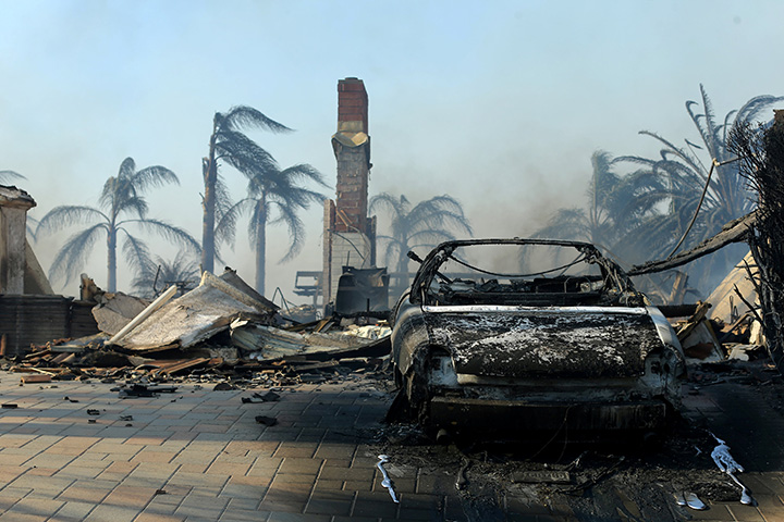 The remains of a home are seen after it burned to the ground during a wind-driven wildfire in Ventura, California, December 5, 2017.