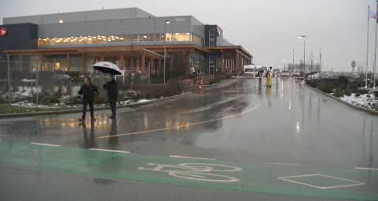 Workers outside the facility on Thursday morning.