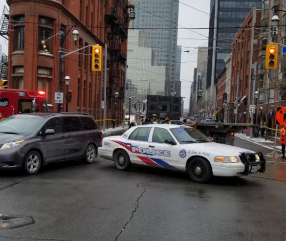 Toronto police say a 23-year-old woman has died after a collision at Church Street and Front Street East Friday afternoon.