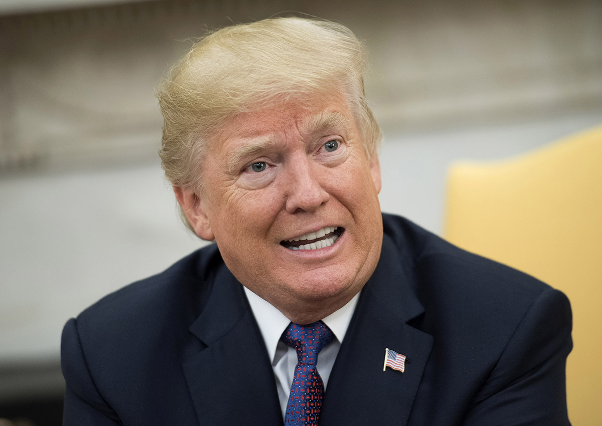 President Donald Trump speaks to the media during a meeting with Governor Ricardo Rossello of Puerto Rico in the Oval Office at the White House on October 19, 2017.