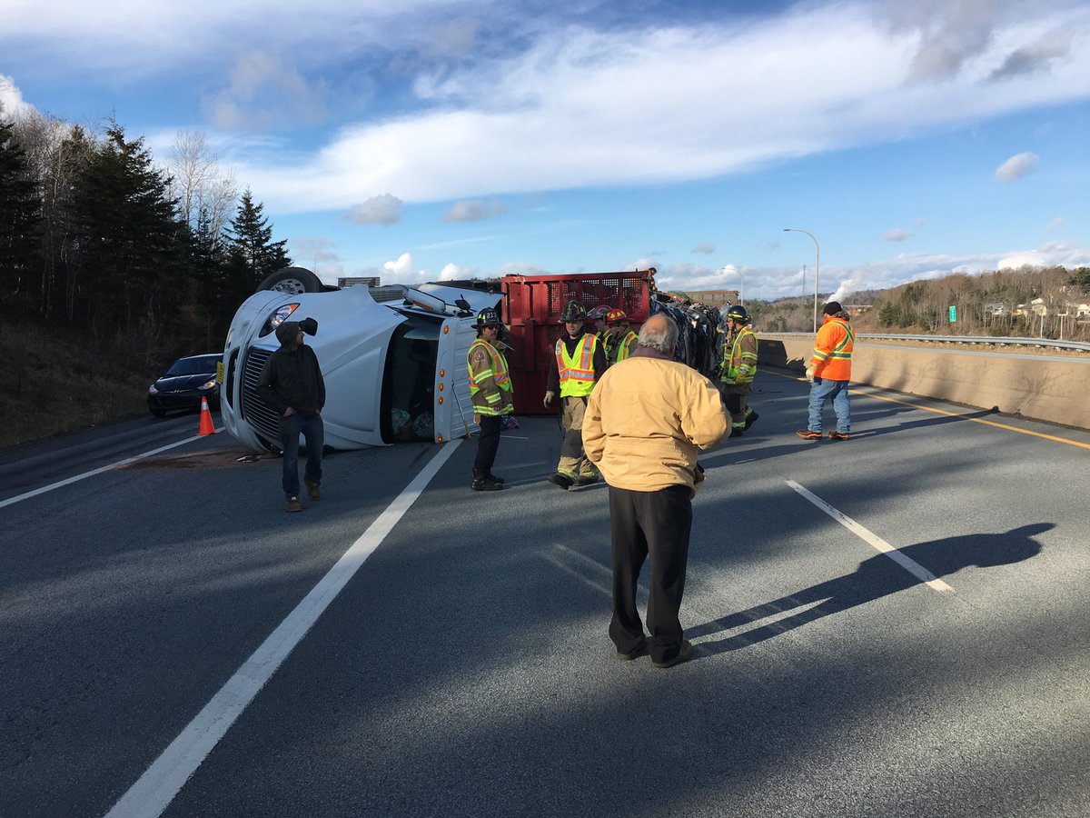 A semi carrying a load of crushed cars overturned in Lower Sackville on Friday. 