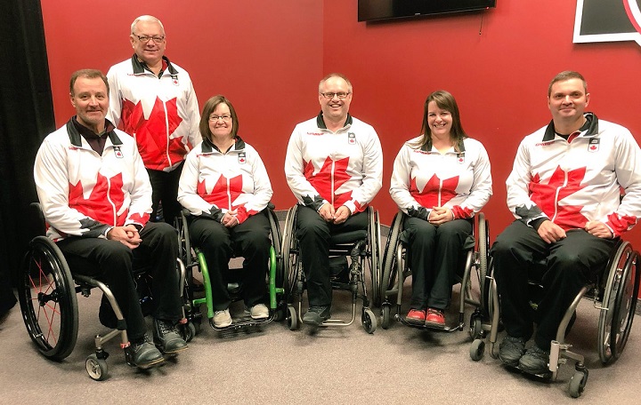 Sanford's Dennis Thiessen (centre) and Oak Bluff's Jamie Anseeuw (left) pose with their teammates after being named to Canada's 2018 Paralympic wheelchair curling team.