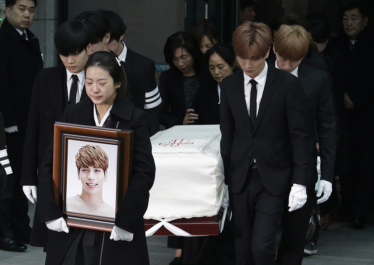 A coffin of late South Korean singer Kim Jong-hyun, better known by the stage name Jonghyun, a member of South Korean K-pop group SHINee, is carried by his group members.