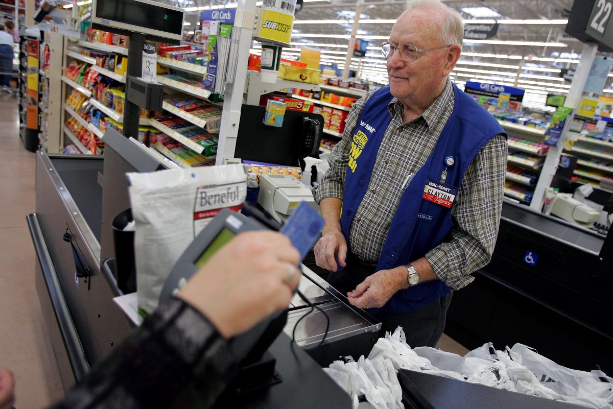 Clayton Fackler, 72, works at the check out at the new 2,000 square foot Wal-Mart Supercenter store.  