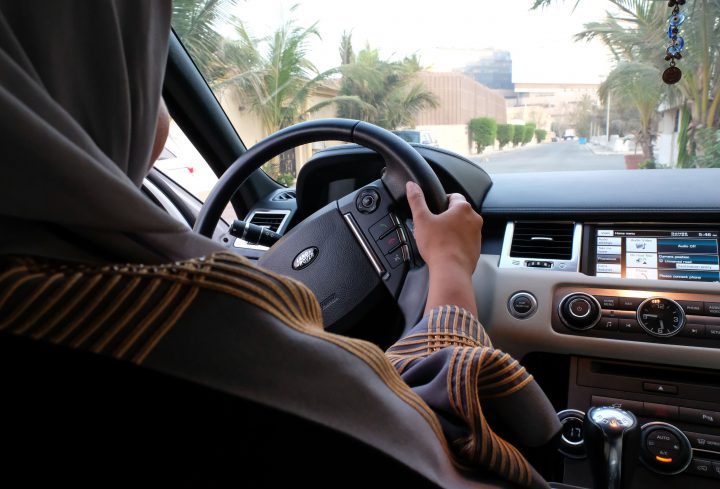 A Saudi woman drives her car along a street in the Saudi coastal city of Jeddah, on Sept. 27, 2017. 