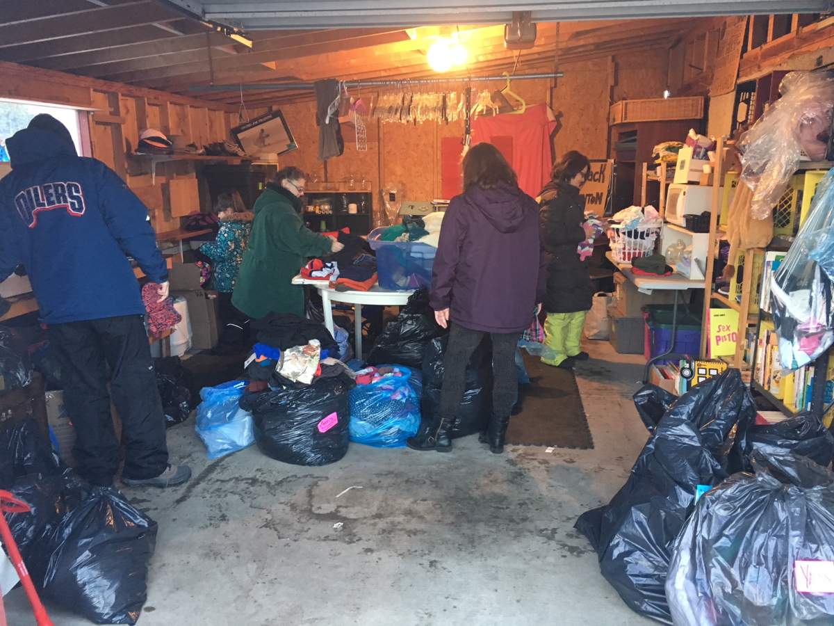 Volunteer sorting donations.