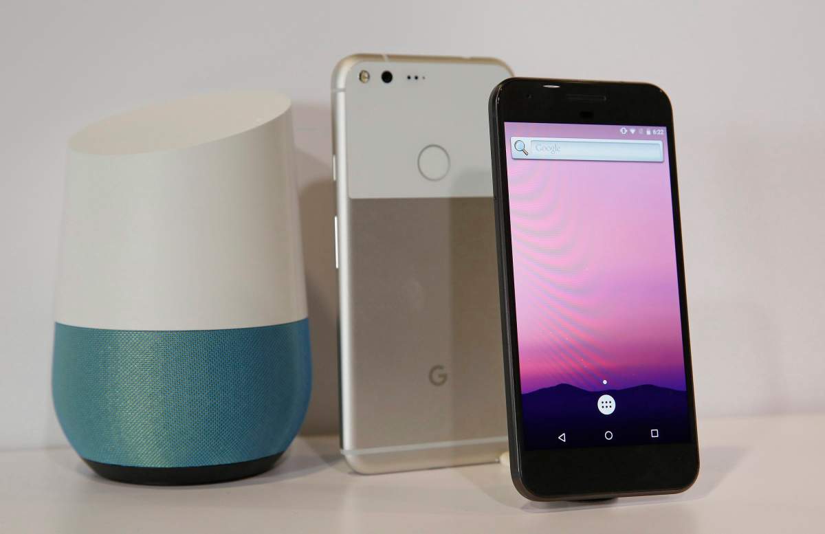 A Google Pixel phone next to a Google Home smart speaker. (AP Photo/Eric Risberg)