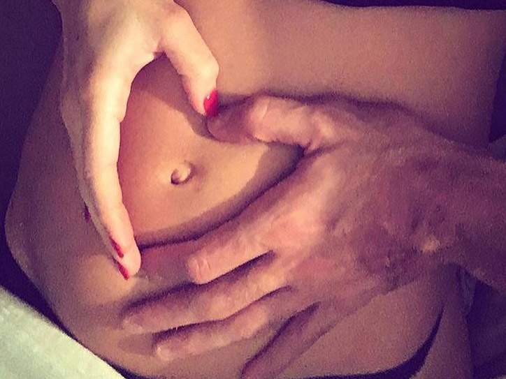 A Spanish model and reality TV star recently shared a picture of her unusual baby bump, which is shaped like a heart. 