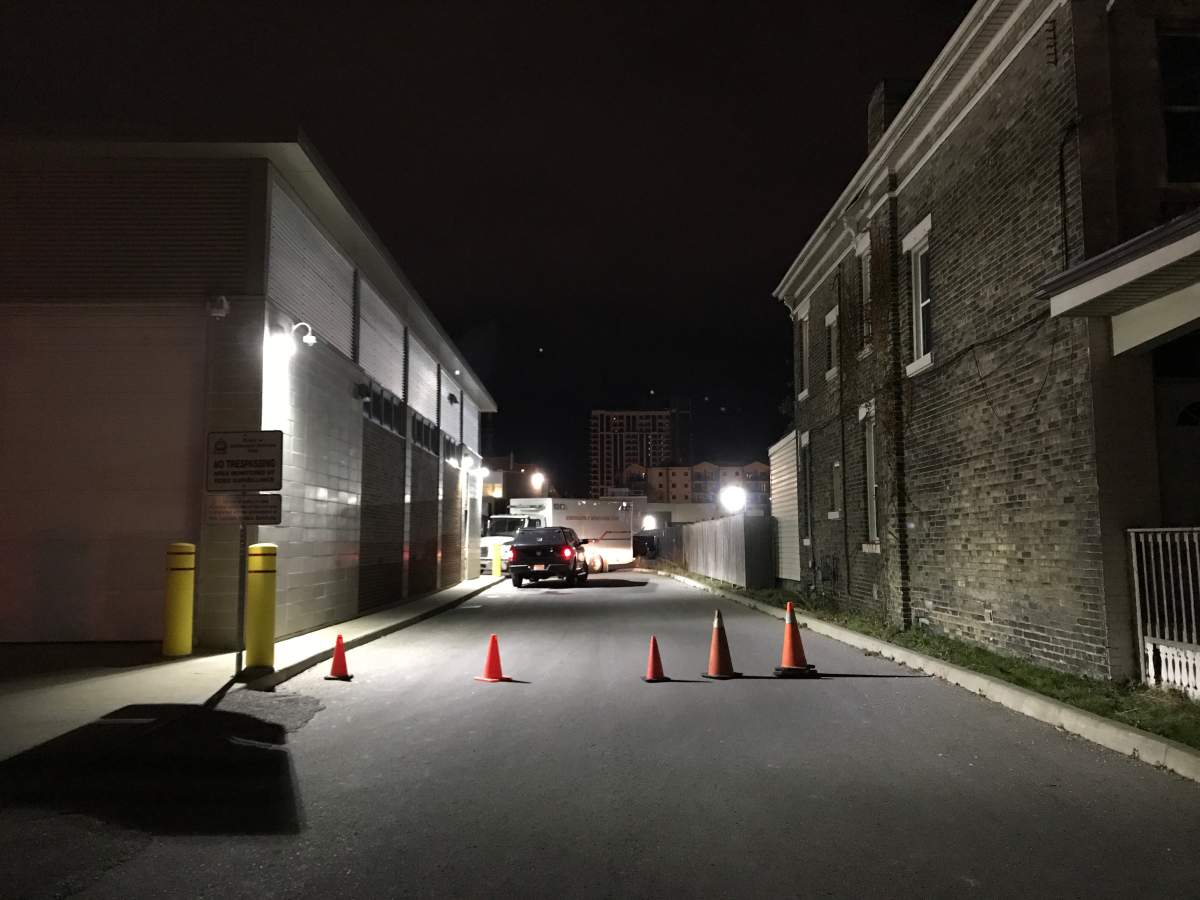 Vehicles and pylons block the laneway off William Street at LPS Headquarters on December 7, 2017.