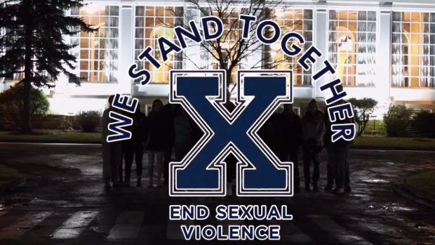 Some female athletes at St. Francis Xavier University have come up with a compelling response to sex charges against members of the varsity football team. A still image is shown from the campaign's video.