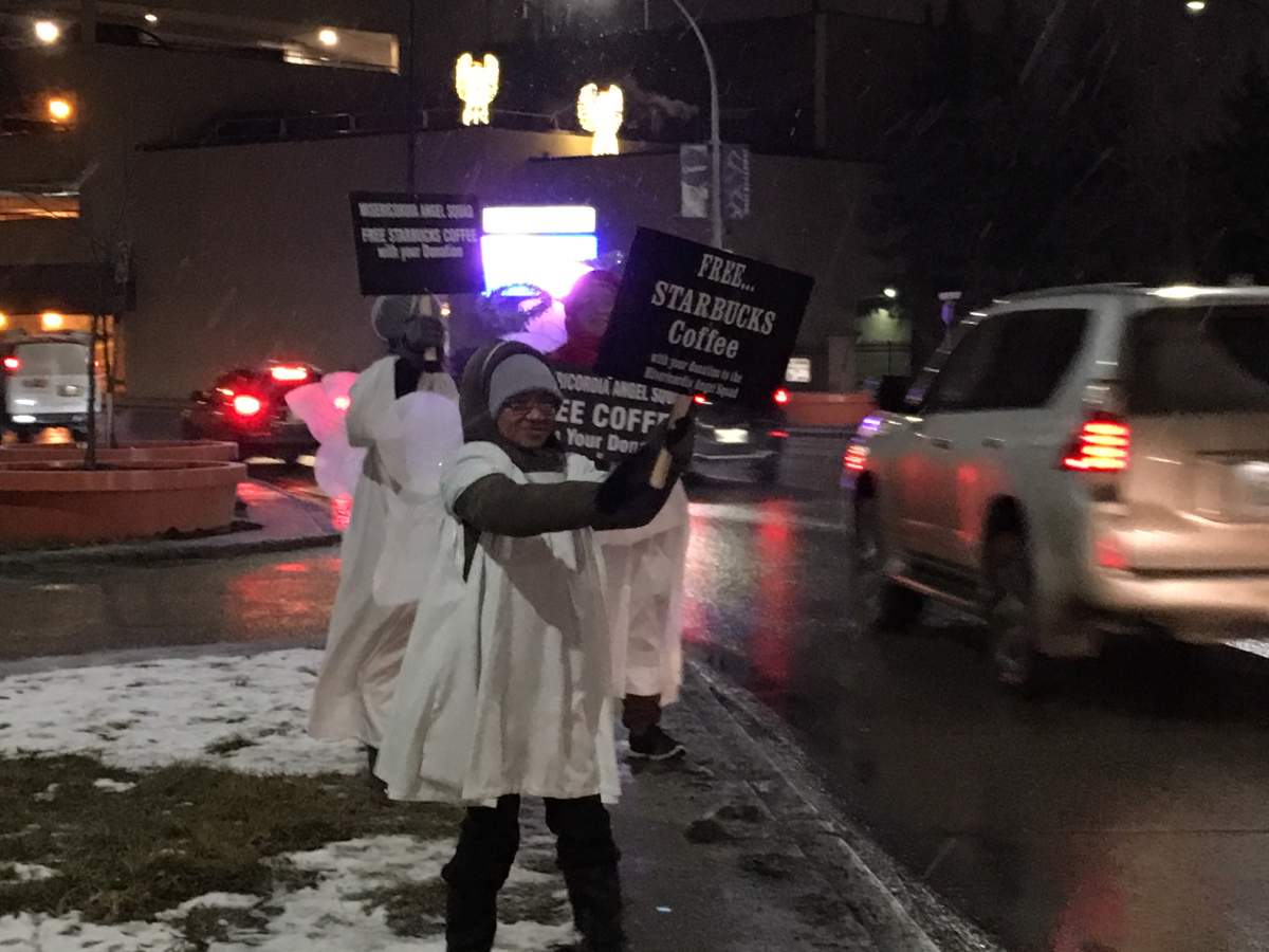 The Angel Squad is set up at the Maryland Bridge accepting donations and giving away free coffee. 