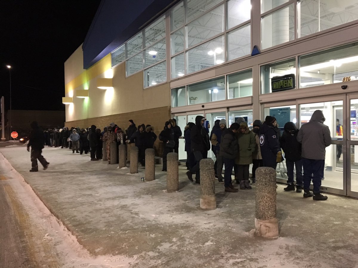 Shoppers line up in front of Best Buy in St. James before 6 a.m. on Boxing Day despite the temperature, with the windchill dipping below  -40 degrees celsius.