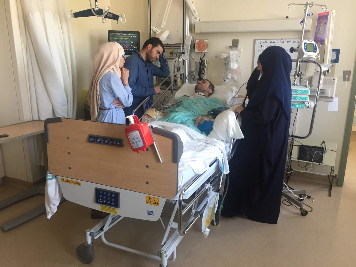 Aymen Derbali is attended to in hospital after being shot seven times during the Quebec City mosque shooting.