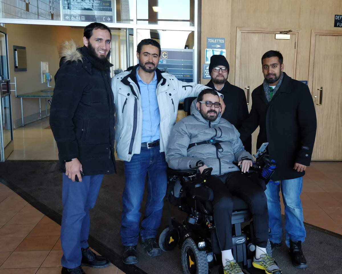 Aymen Derbali, who stands with members of DawaNet, was left paralyzed after the Quebec City mosque shooting.