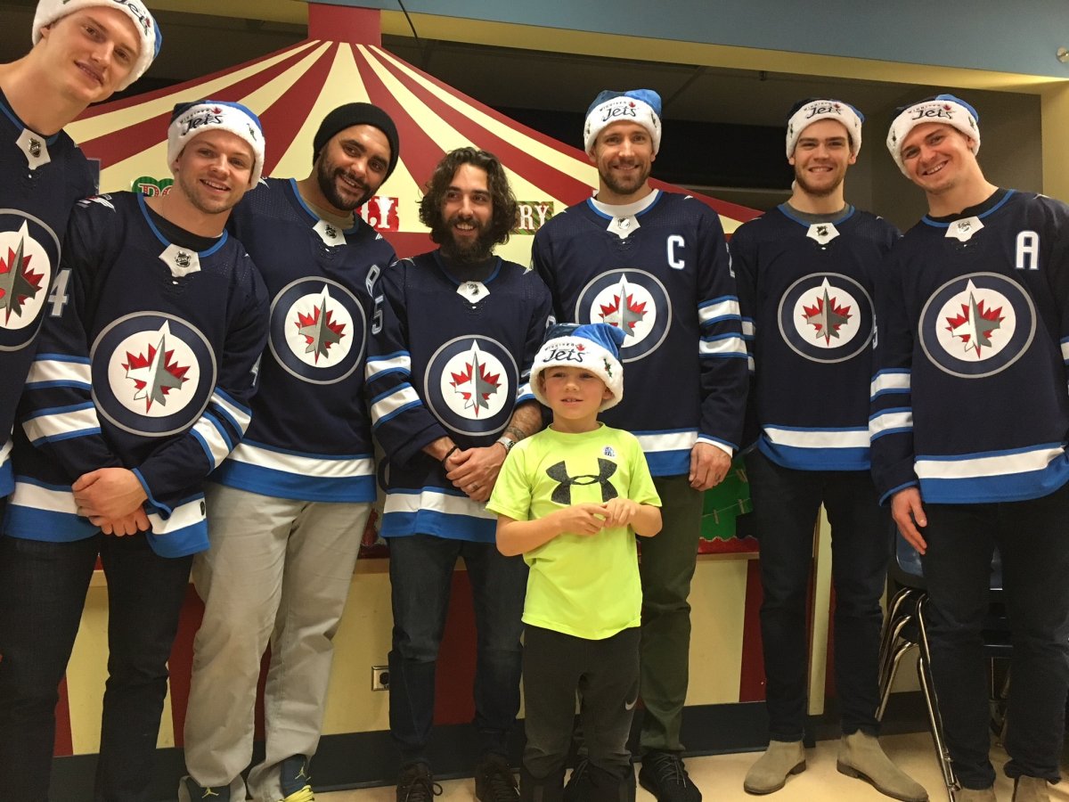 Winnipeg Jets players posed for pictures during their annual holiday hospital tour Dec. 13.