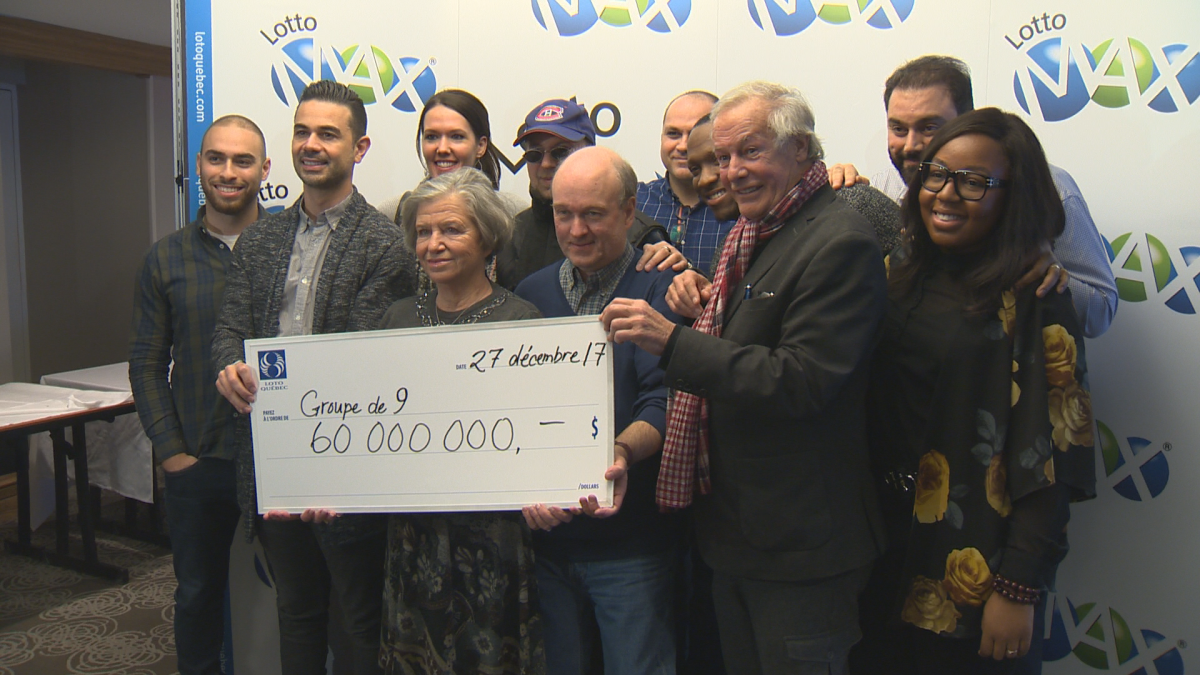 Lotto Max jackpot winners pose for a photo in Montreal on Dec. 27, 2017.