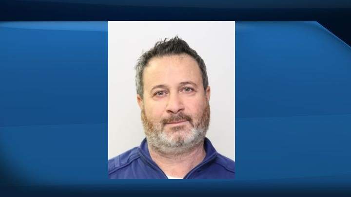 Majed "Mark" Zeitouni is described as five foot seven and 170 pounds with dark-rimmed glasses and facial hair.
