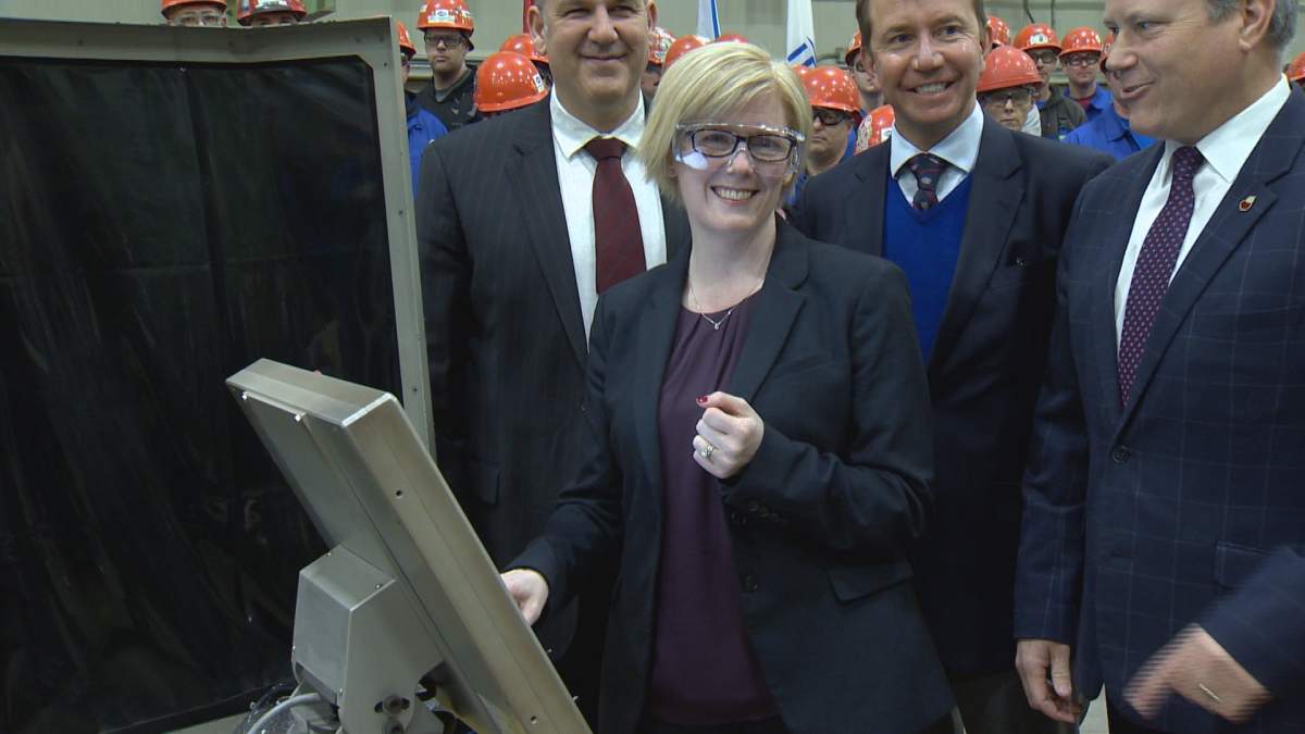Minister of Procurement Canada, Carla Qualtrough, performs the ceremonial  cutting of the first steel for HMCS Max Bernays at Irving Shipyard in Halifax on Dec. 19, 2017. 
