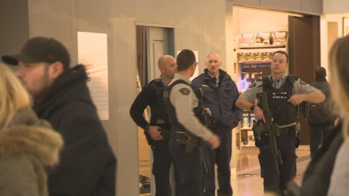RCMP officers patrol a Penticton shopping centre on a report of a person with a gun. 