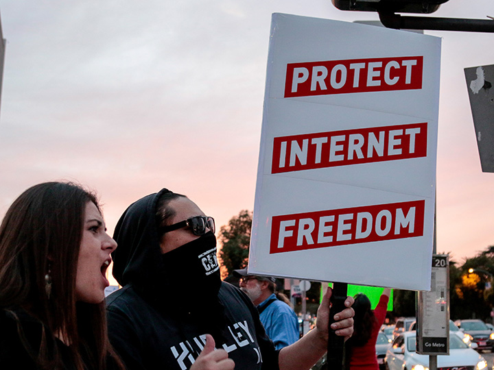 Supporters of net neutrality protest the FCC's recent decision to repeal the program in Los Angeles, Calif., on Nov. 28, 2017.