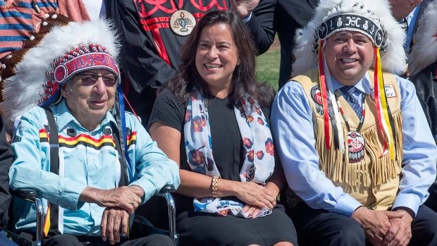 FILE - Mi'kmaq Grand Chief Ben Sylliboy is seen on the left, next to Justice Minister Jody Wilson-Raybould and Morley Googoo, regional chief for Nova Scotia and Newfoundland, at a meeting of Atlantic MPs and First Nations chiefs in Wolfville, N.S. on Thursday, Aug. 10, 2017. Sylliboy died on Thursday afternoon in hospital. 