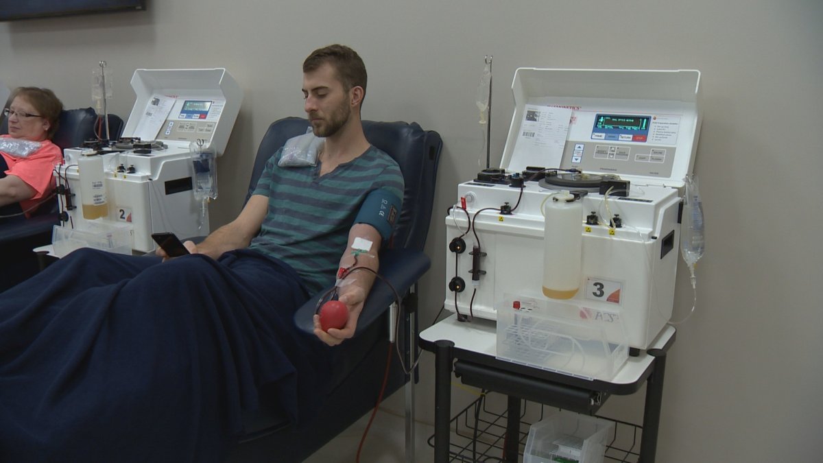 A donor gives plasma at Canadian Plasma Resources where donor compensation is on the rise.