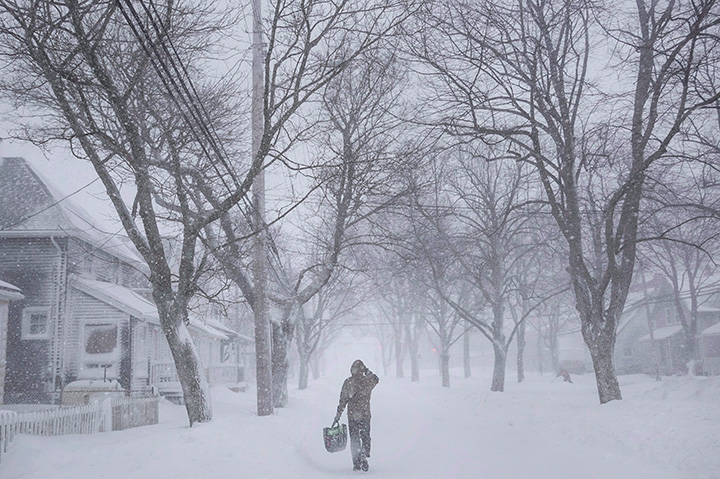 A man walks down the middle of Agricola Street in Halifax as a major winter storm blasts the Maritimes on Feb. 13, 2017. 