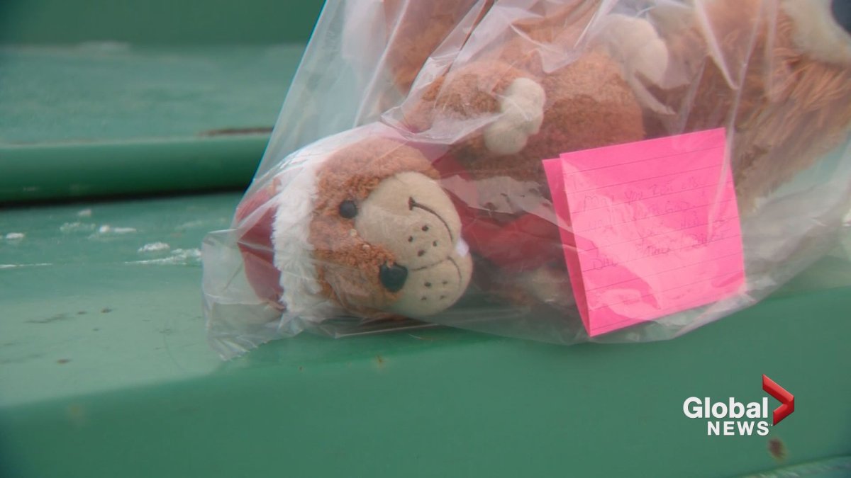 A teddy bear is placed in memory of a newborn infant who was found dead on Christmas Eve.