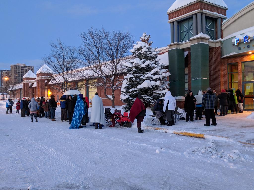 Londoners wait in the snow ahead of the start of the 2017 Salvation Army Christmas Hamper campaign.