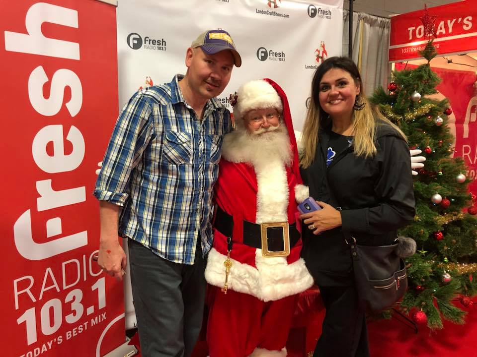 Jeff and Isabel Traher pose with Santa at the 38th annual Christmas Craft Festival.