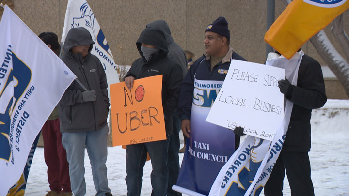 Taxi drivers rallied outside of Saskatoon city hall to raise concerns over ride-sharing coming to the city.