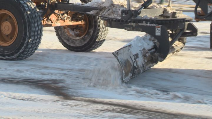 Snowplows clearing streets in Alberta.