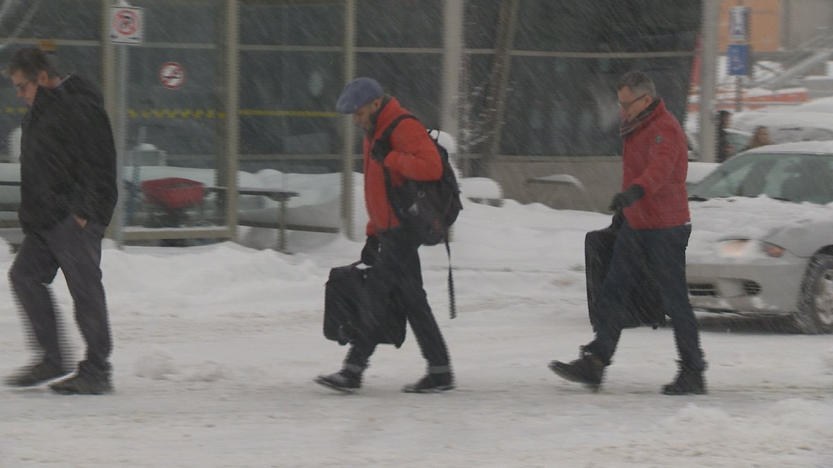 Travellers at Kelowna airport endure the snow. 