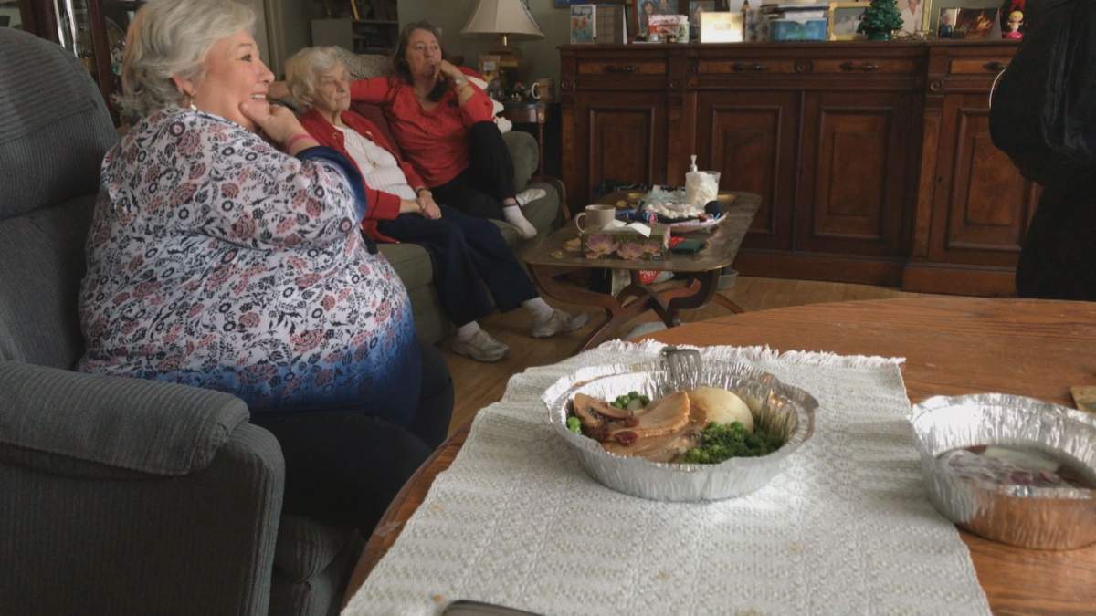 Eleanor Tait and her daughters in her home on Tuesday, Dec. 19, 2017.