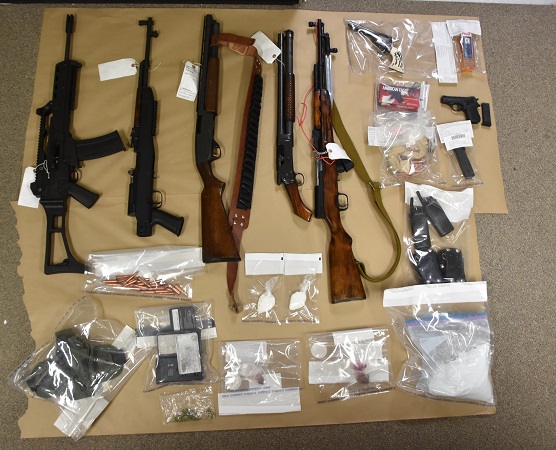The illegal arsenal included three semi-automatic assault rifles, two sawed-off shotguns and ammunition.