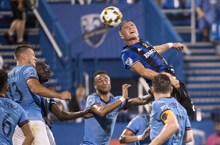 Montreal Impact defender Kyle Fisher heads the ball towards the New York City FC net during first half MLS action Wednesday, September 27, 2017 in Montreal. 